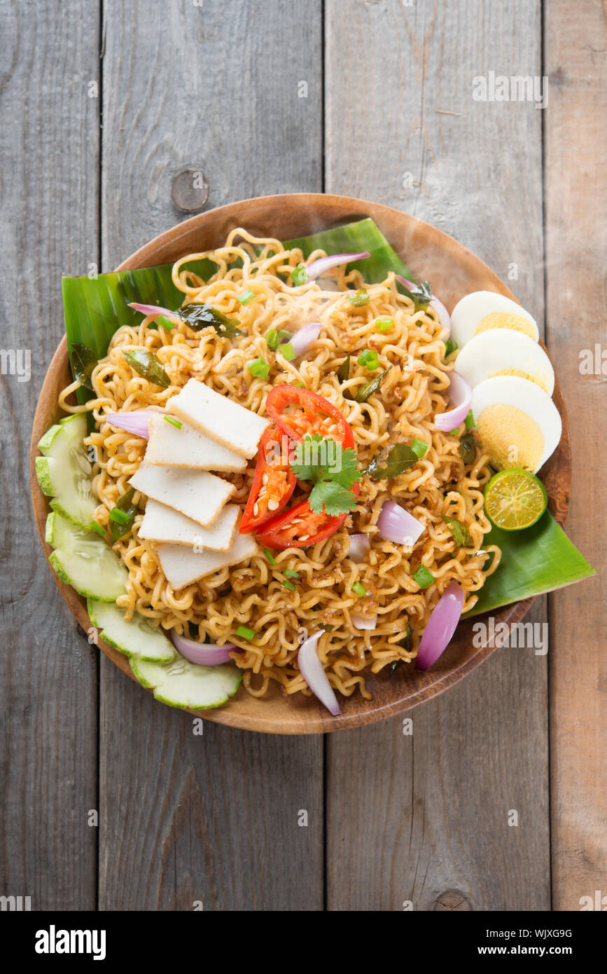 Malaysian Style Maggi Goreng Mamak Or Spicy Dried Curry Instant Noodles Asian Cuisine Ready To Serve On Wooden Dining Table Setting Fresh Hot Wit Stock Photo Alamy