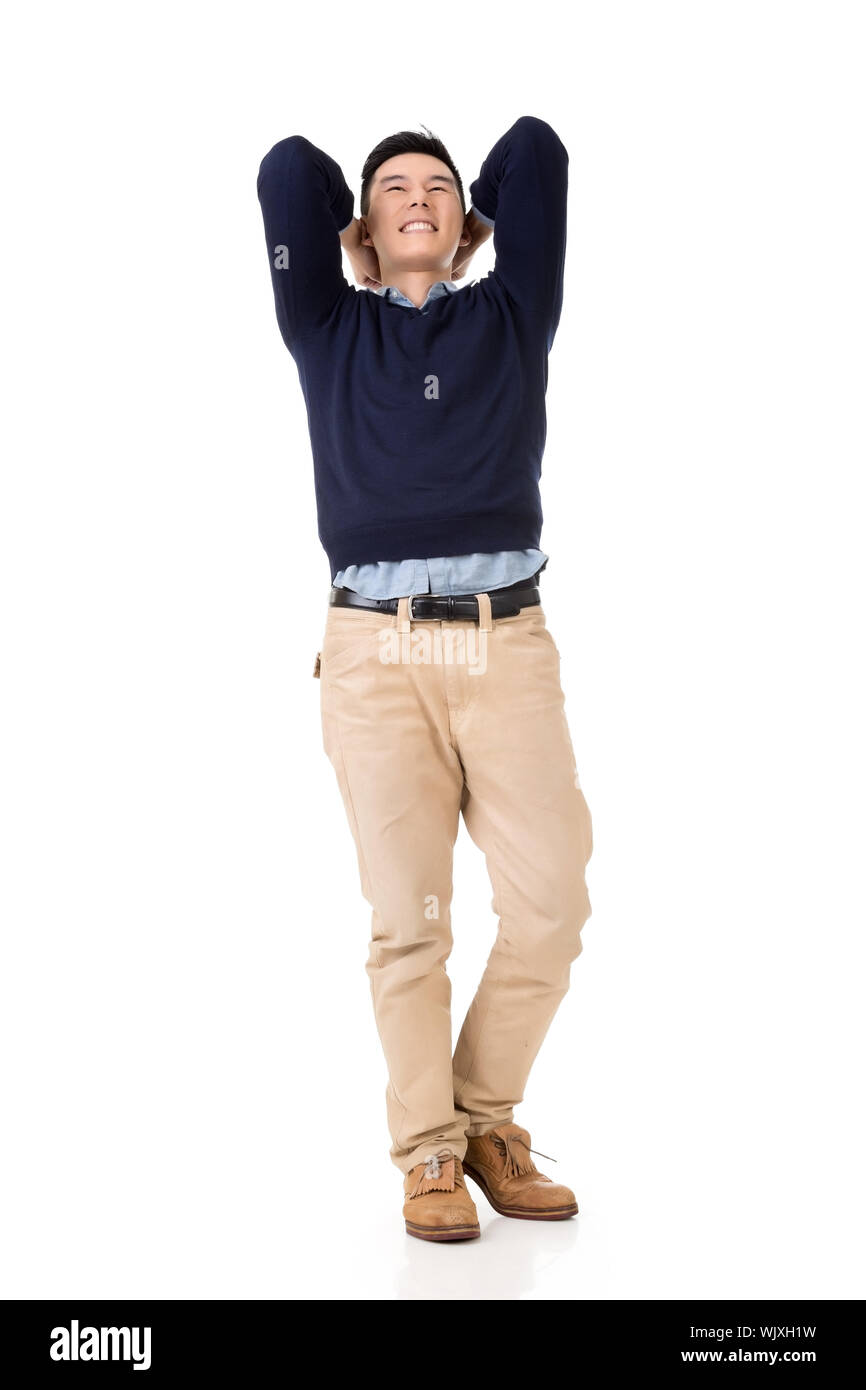 Excited Asian young man, full length portrait Stock Photo - Alamy