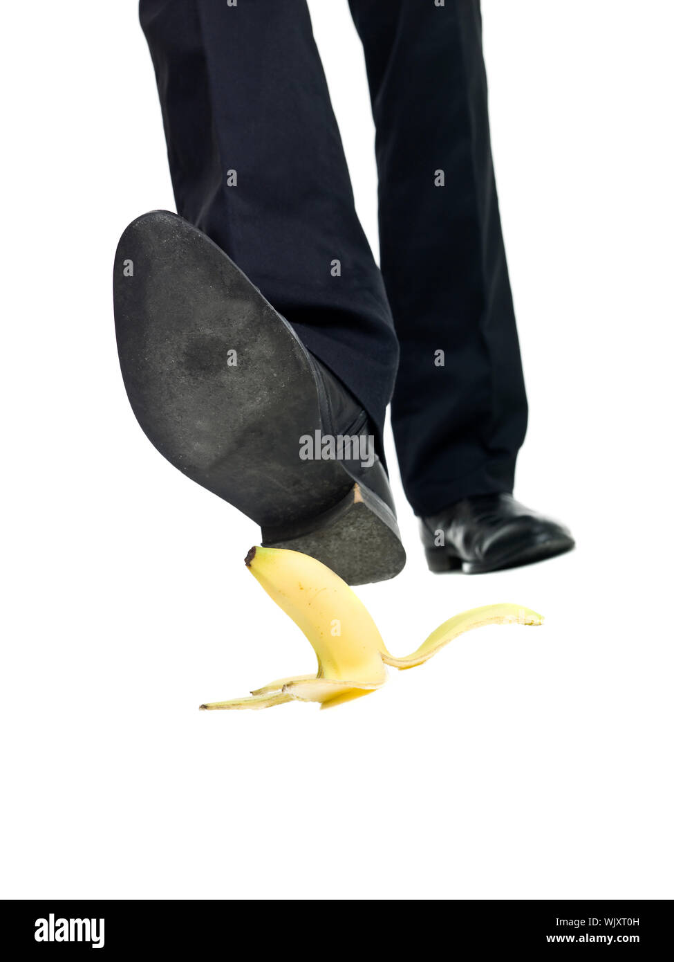 Banana peel slip isolated on white background Stock Photo Alamy