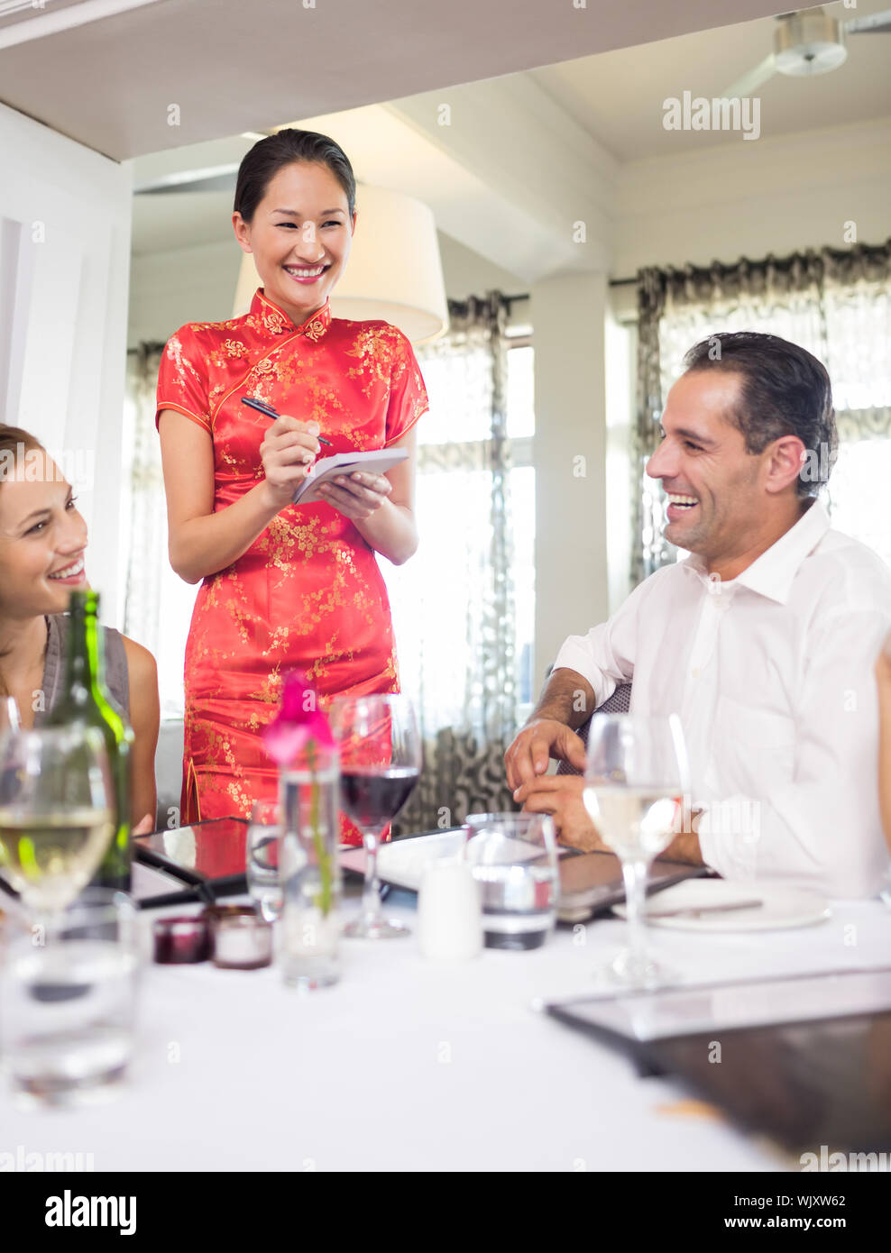 Business colleagues sitting around dining table in the restaurant Stock Photo