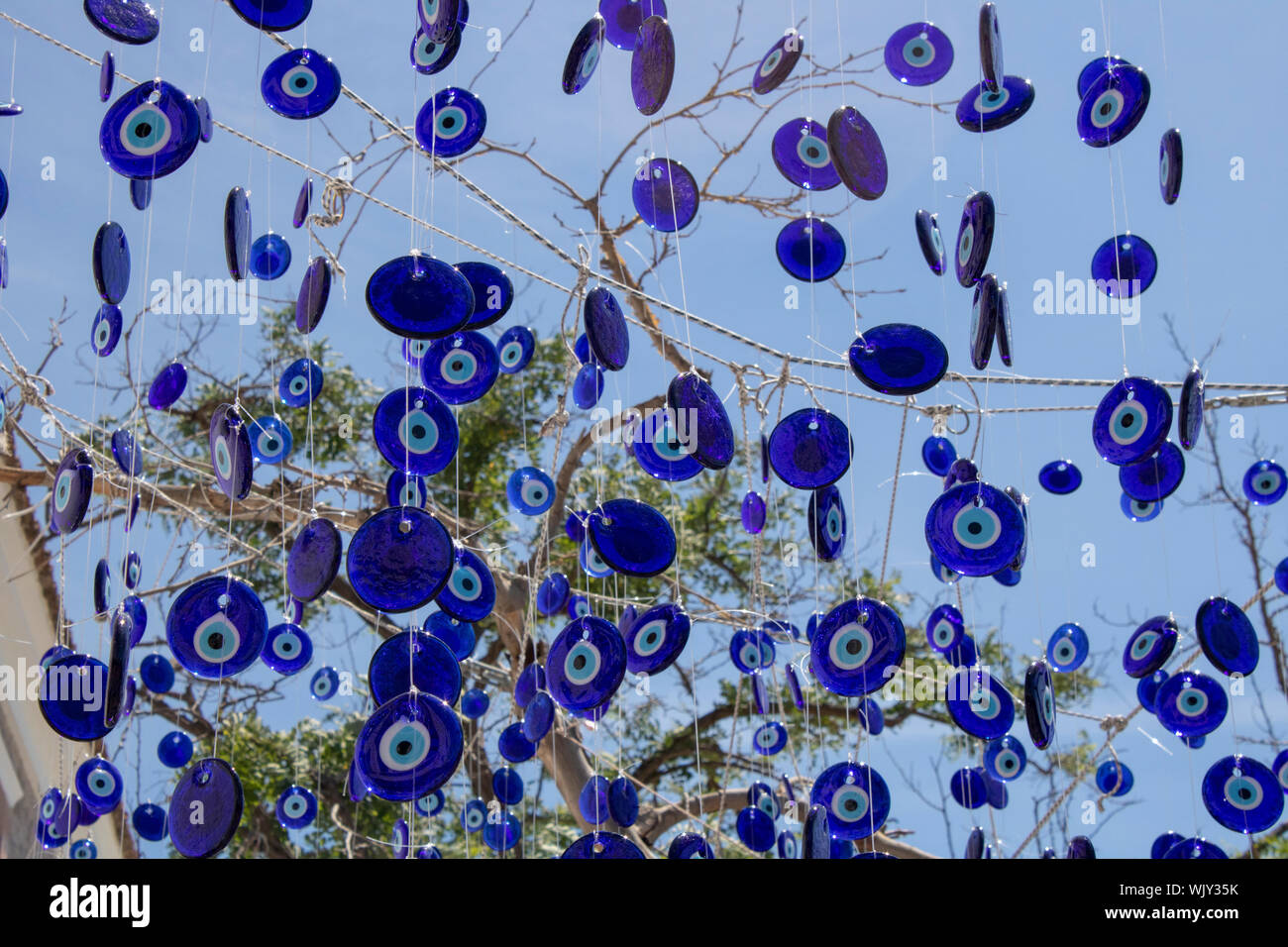 Traditional evil eye bead. Souvenir. Blurred background. To bring good