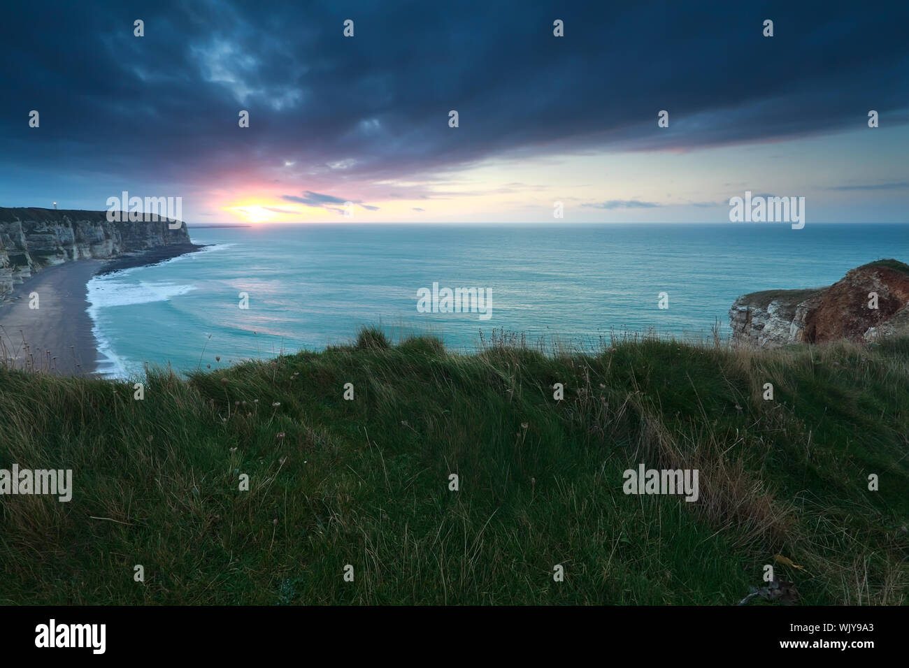Sunrise over the cliff of etretat in normandy hi-res stock photography ...