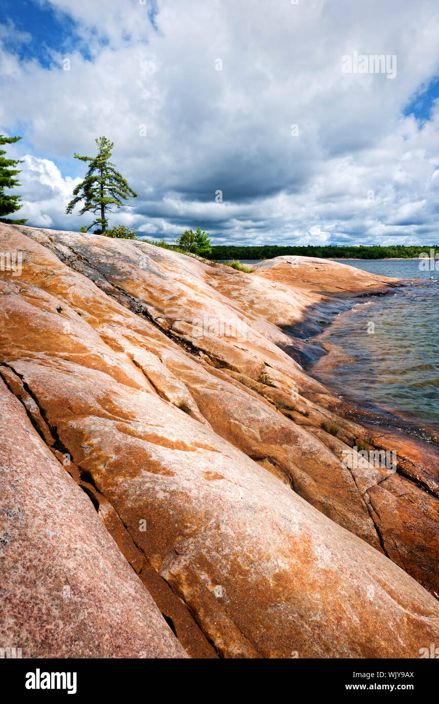 Smooth rocky lake shore of Georgian Bay in Killbear provincial park near Parry Sound, Ontario, Canada. Stock Photo
