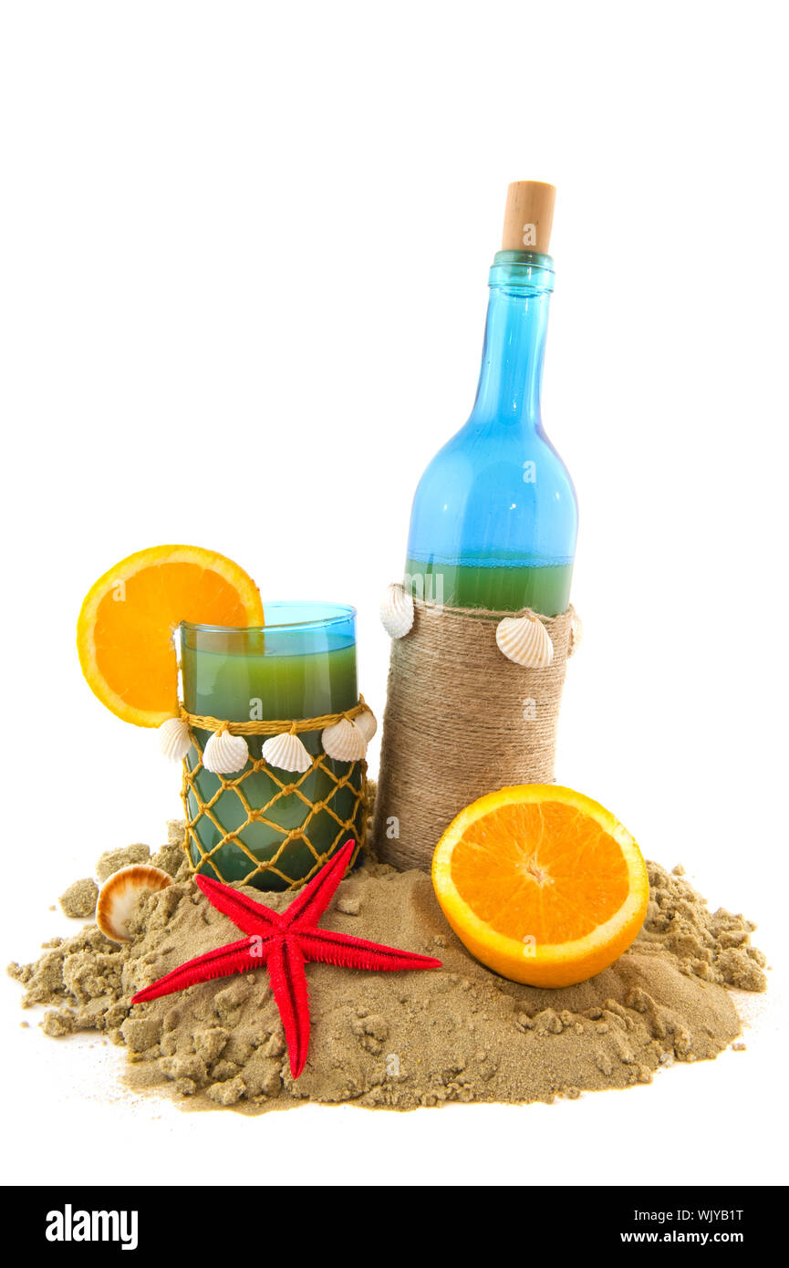 Tropical beach cocktail with fruit in bottle and glass Stock Photo - Alamy