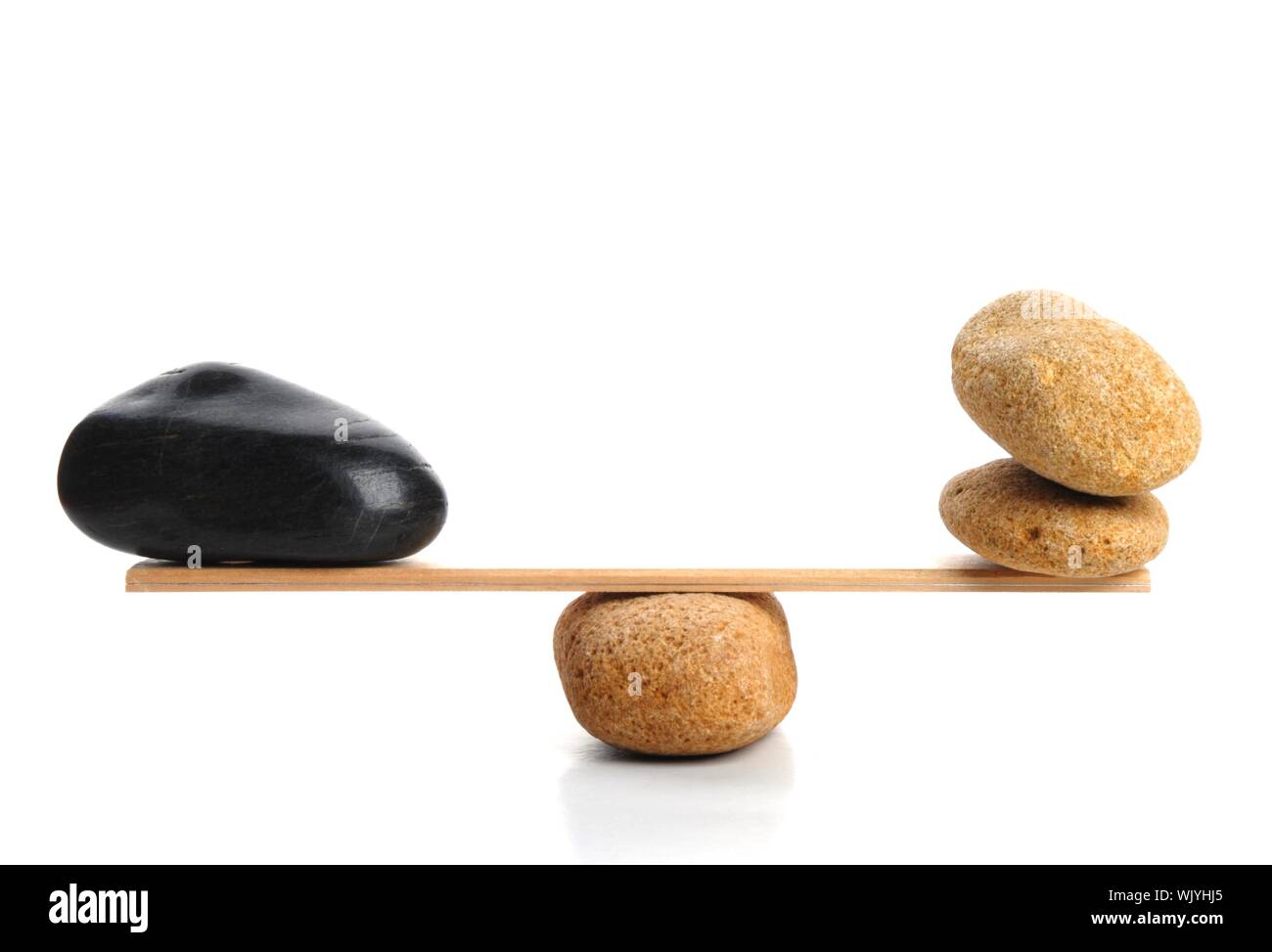 scales with zen stone isolated on white showing balance or spa Stock ...