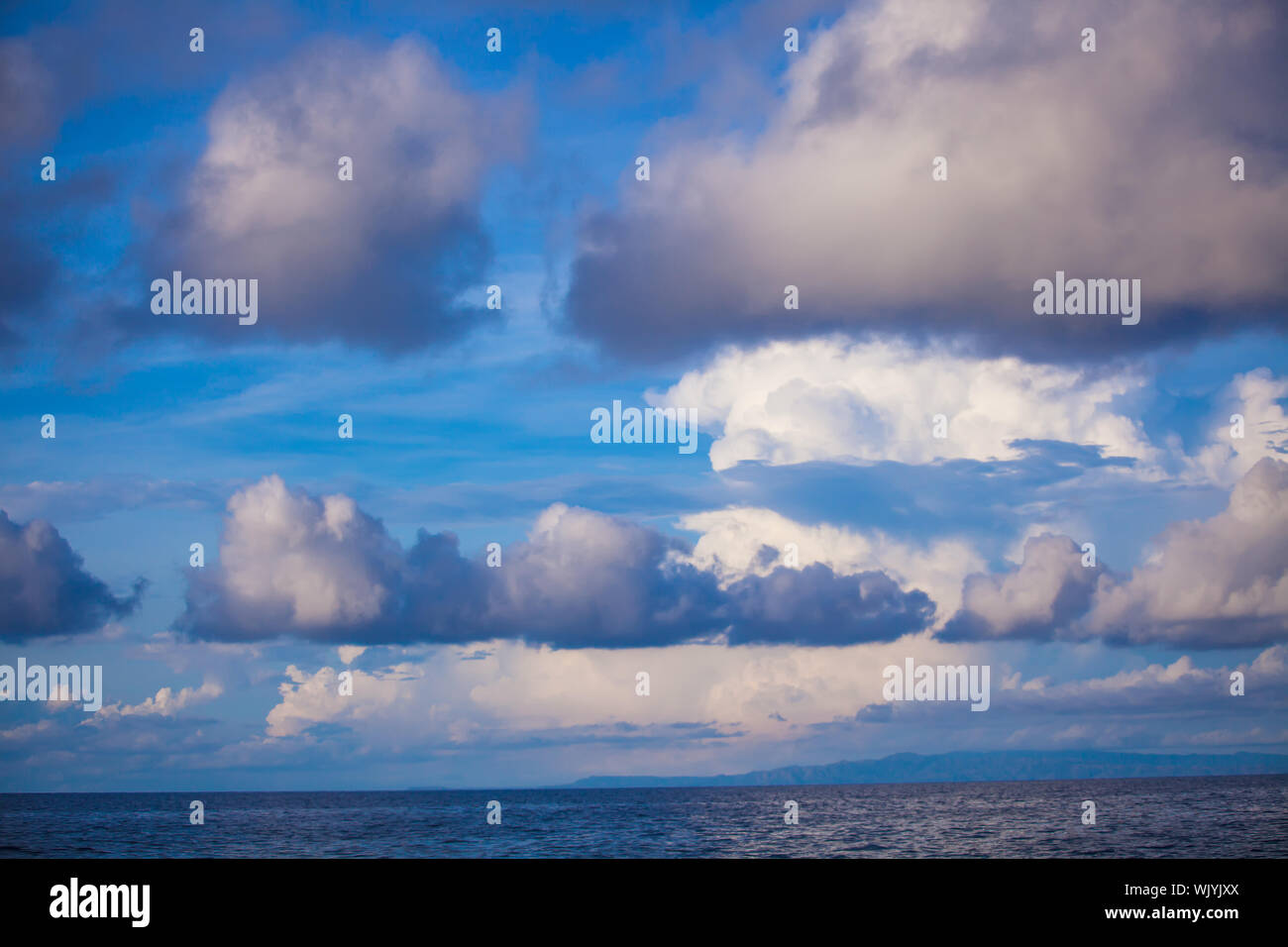 Blue sky with a heap, white clouds Stock Photo