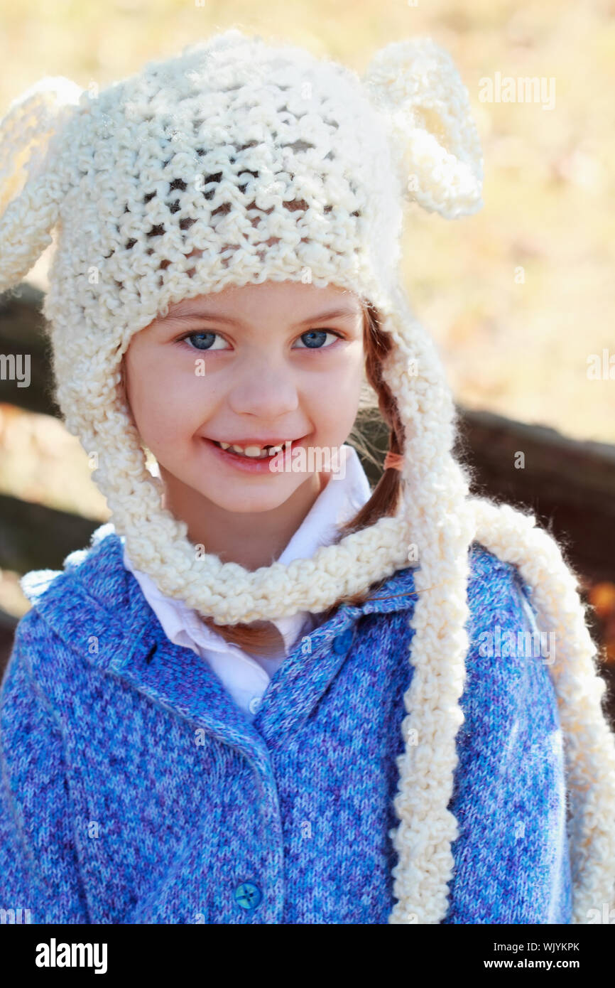 girls white bobble hat