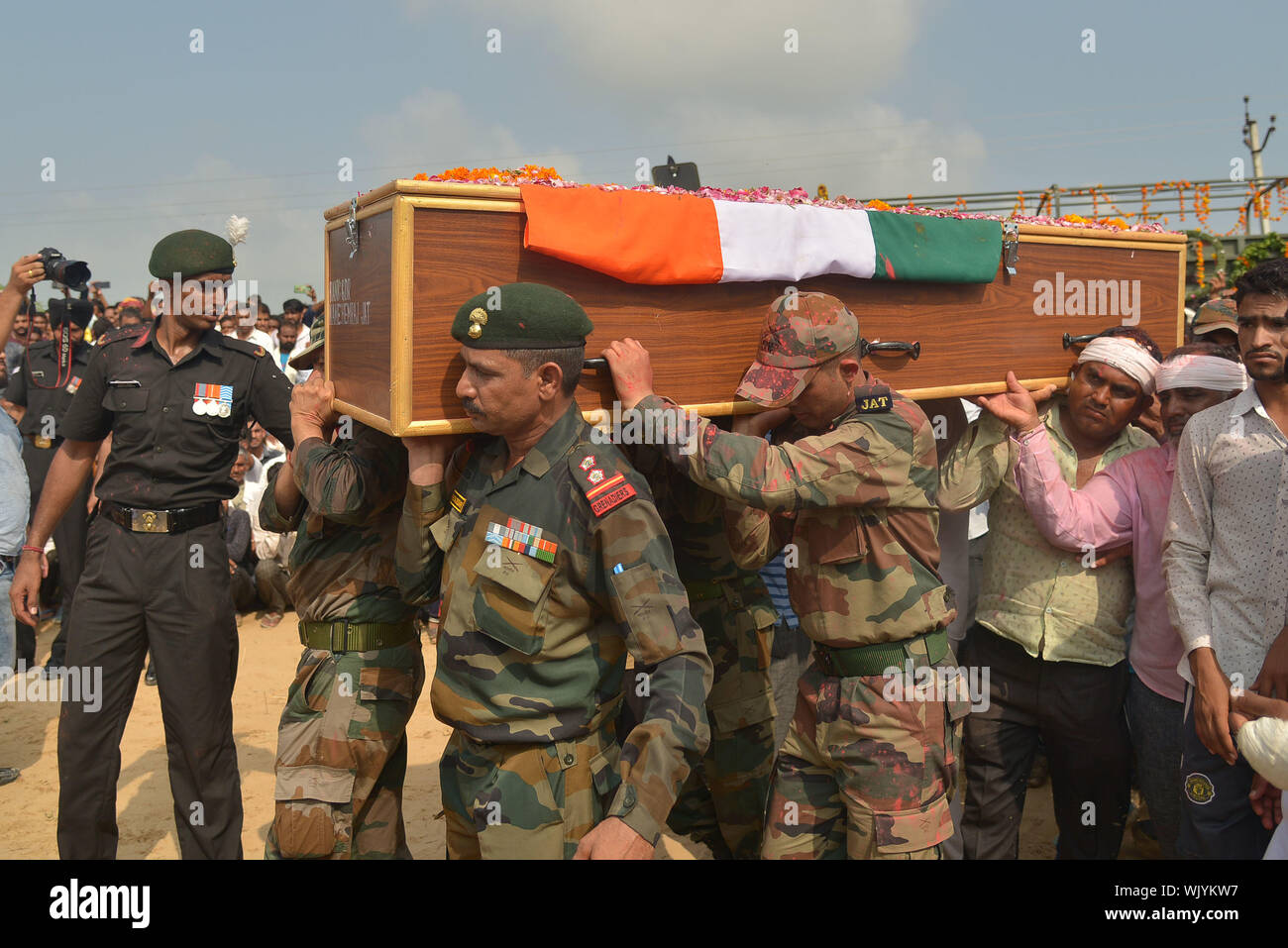 Ajmer, India. 03rd Sep, 2019. People carry the mortal remains of army