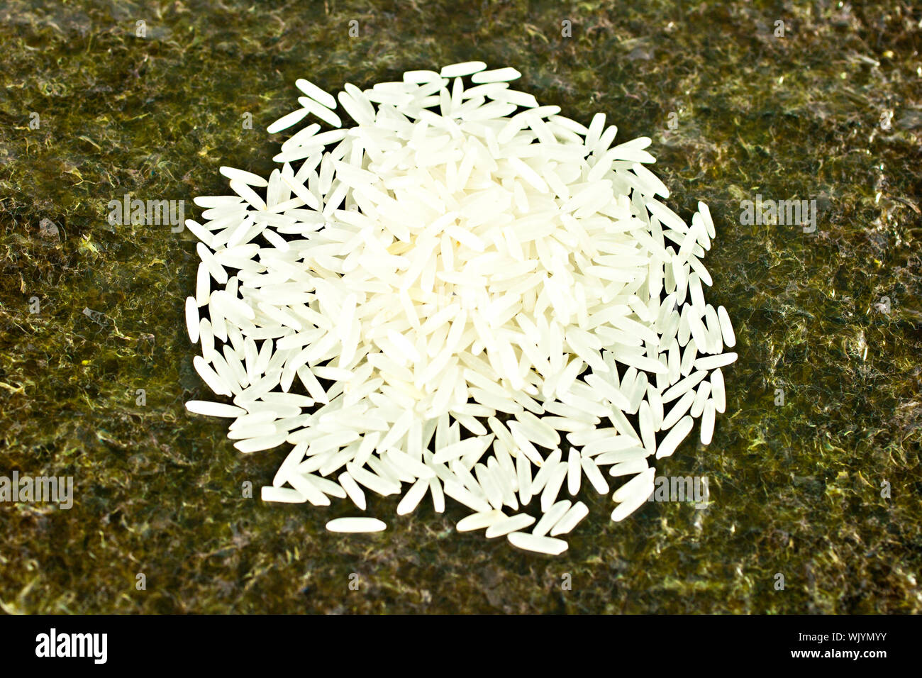 Basmati rice on the sushi maker weed background Stock Photo Alamy