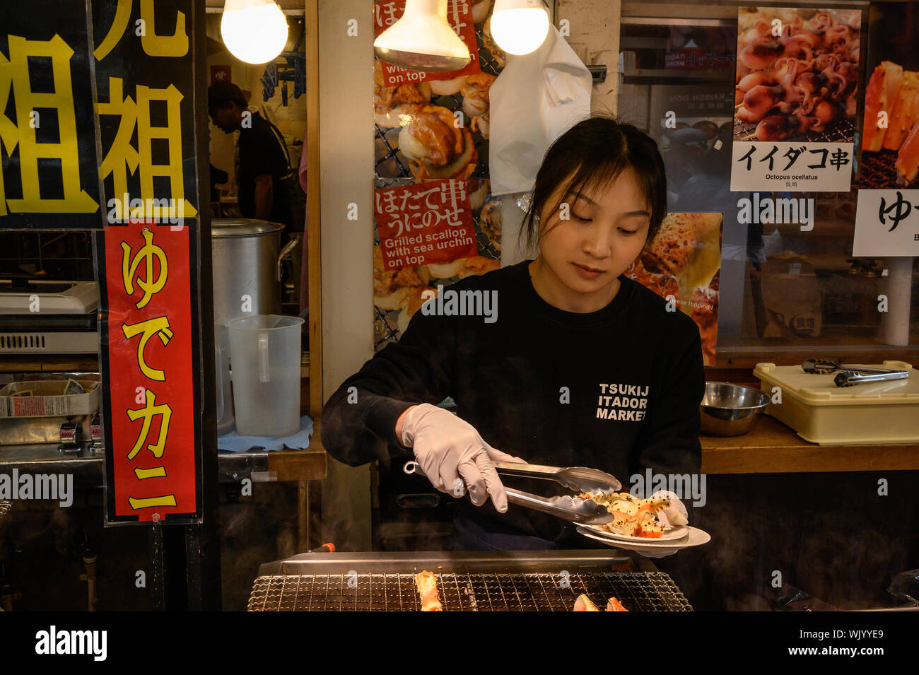 Mature Woman Cooking In Traditional Japanese Kitchen High-Res