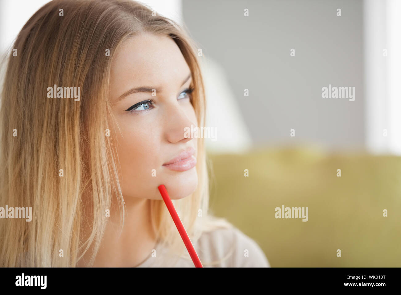 Sitting sofa woman red hair hi-res stock photography and images - Alamy