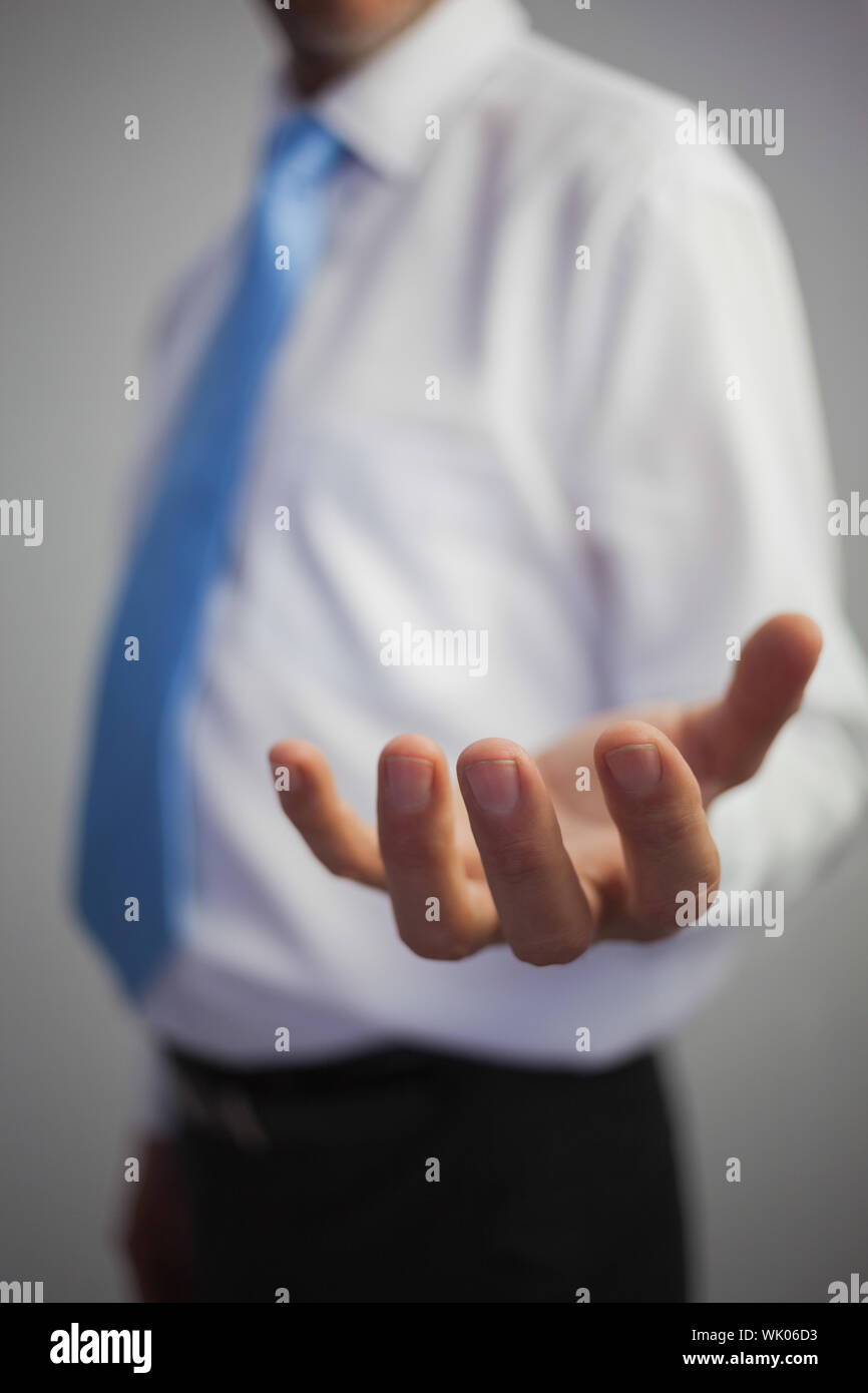 Casual man reaching out hand hi-res stock photography and images - Alamy