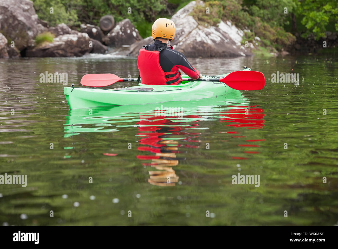 Man taking a break in his kayak Stock Photo