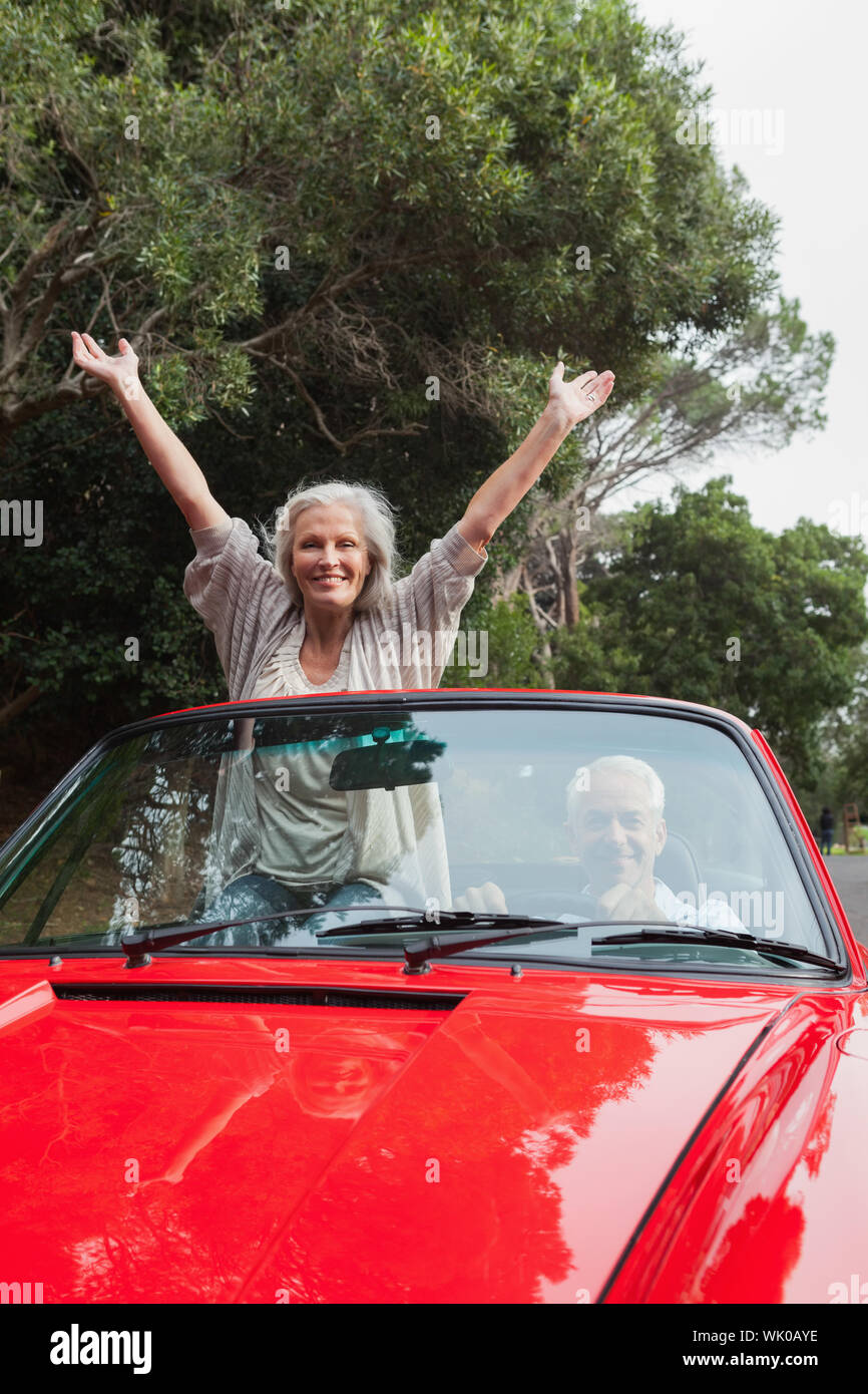 Smiling mature couple having a ride together Stock Photo