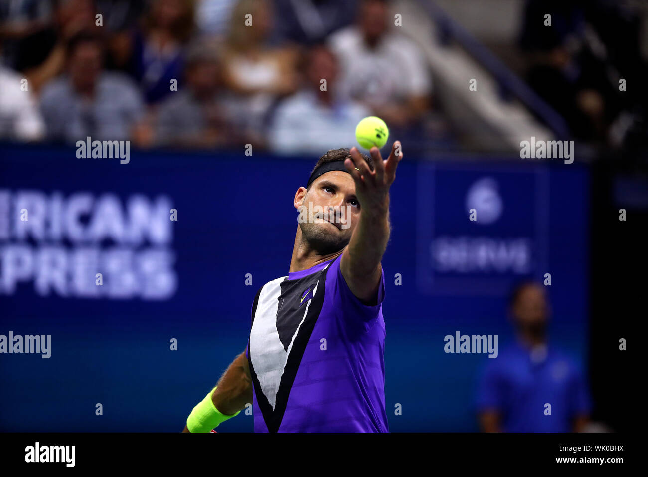 Flushing Meadows, New York, United States - 3 September 2019. Grigor Dimitrov of Bulgaria serving to Roger Federer during their quarter final match at the US Open in Flushing Meadows, New York.  Dimitrov upset Federer in five sets to advance to the semi finals Credit: Adam Stoltman/Alamy Live News Stock Photo