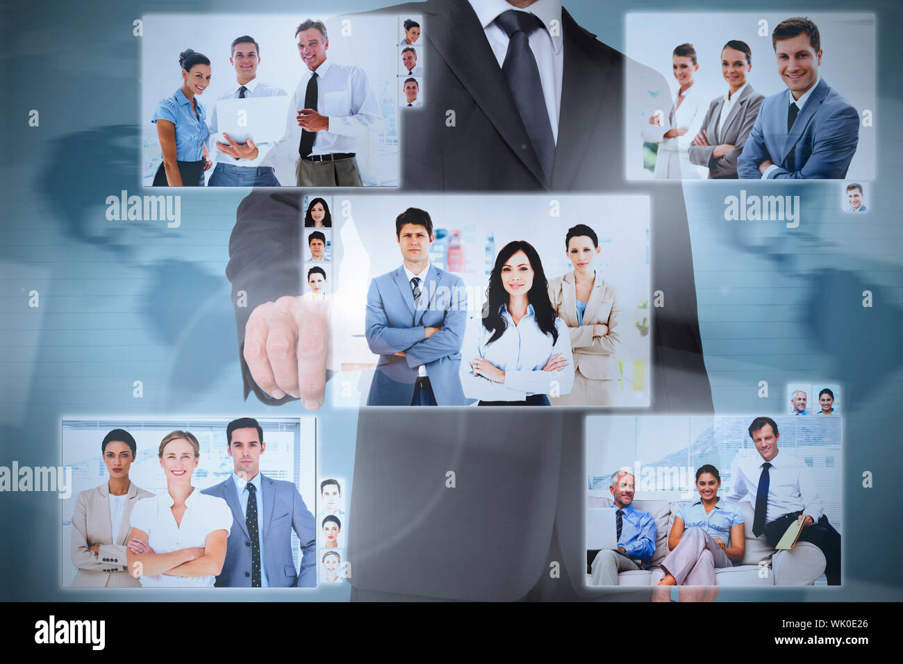 Businessman presenting pictures of coworkers Stock Photo