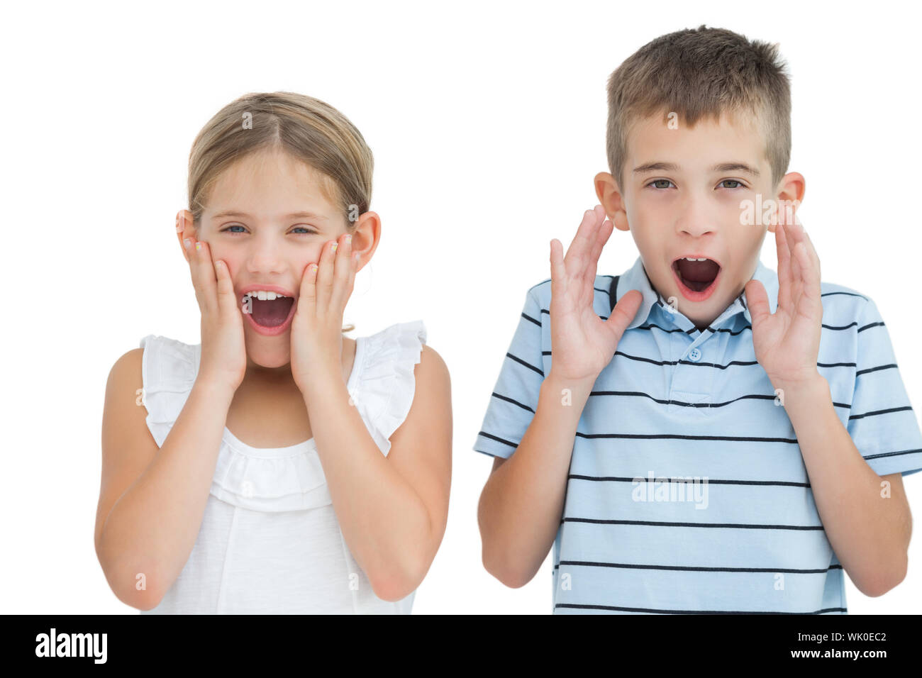 Brother and sister being shocked Stock Photo