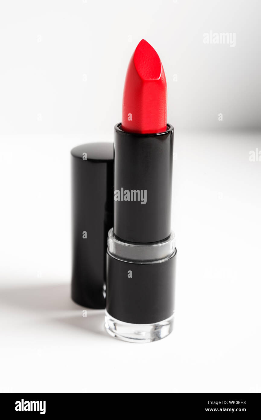 Close-up Of Red Lipstick On Table Stock Photo