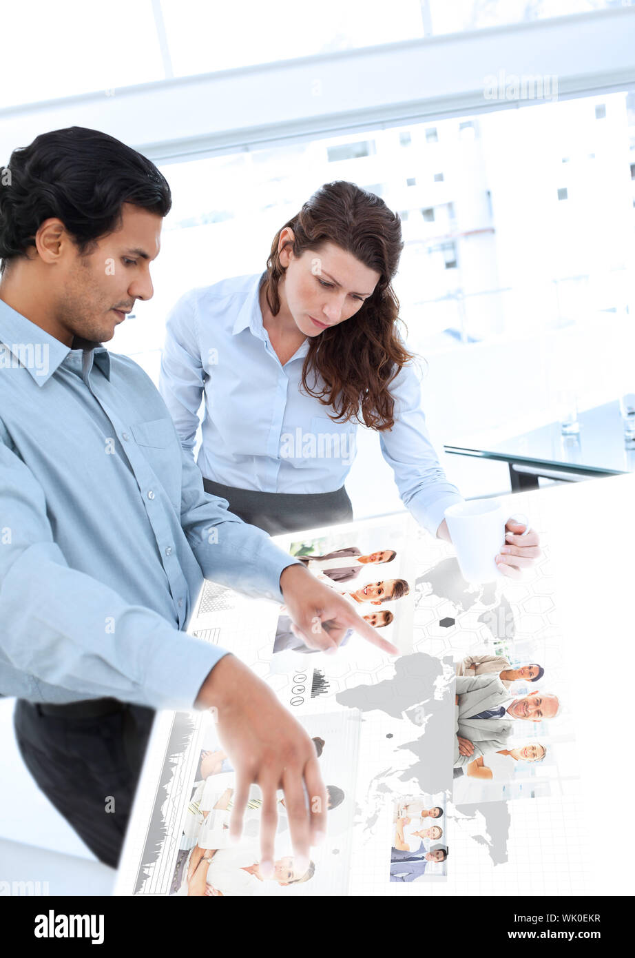 Colleagues working together on digital interface Stock Photo