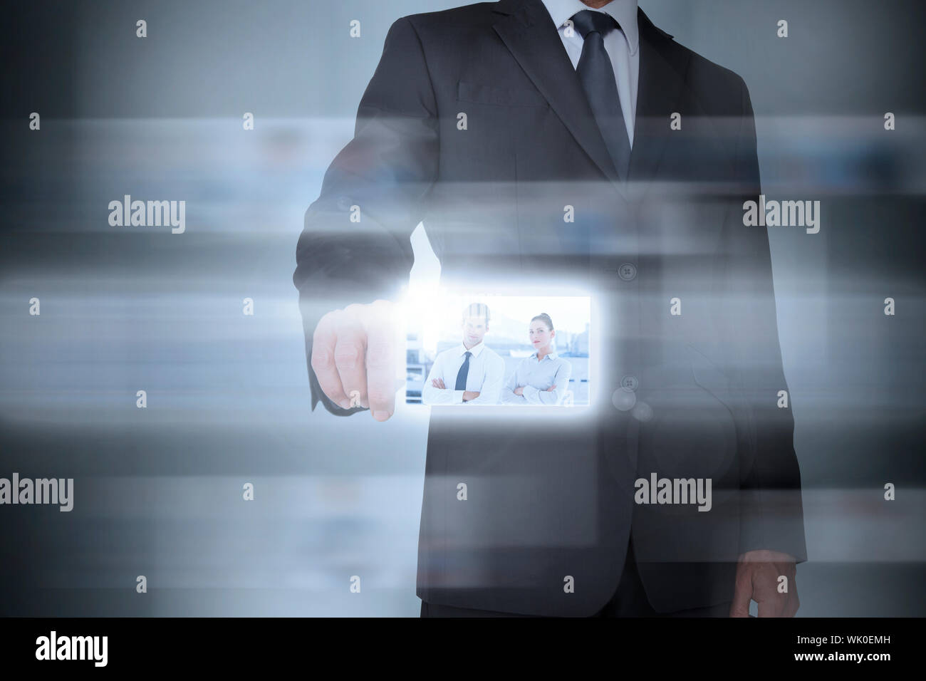 Stylish businessman using futuristic interface Stock Photo