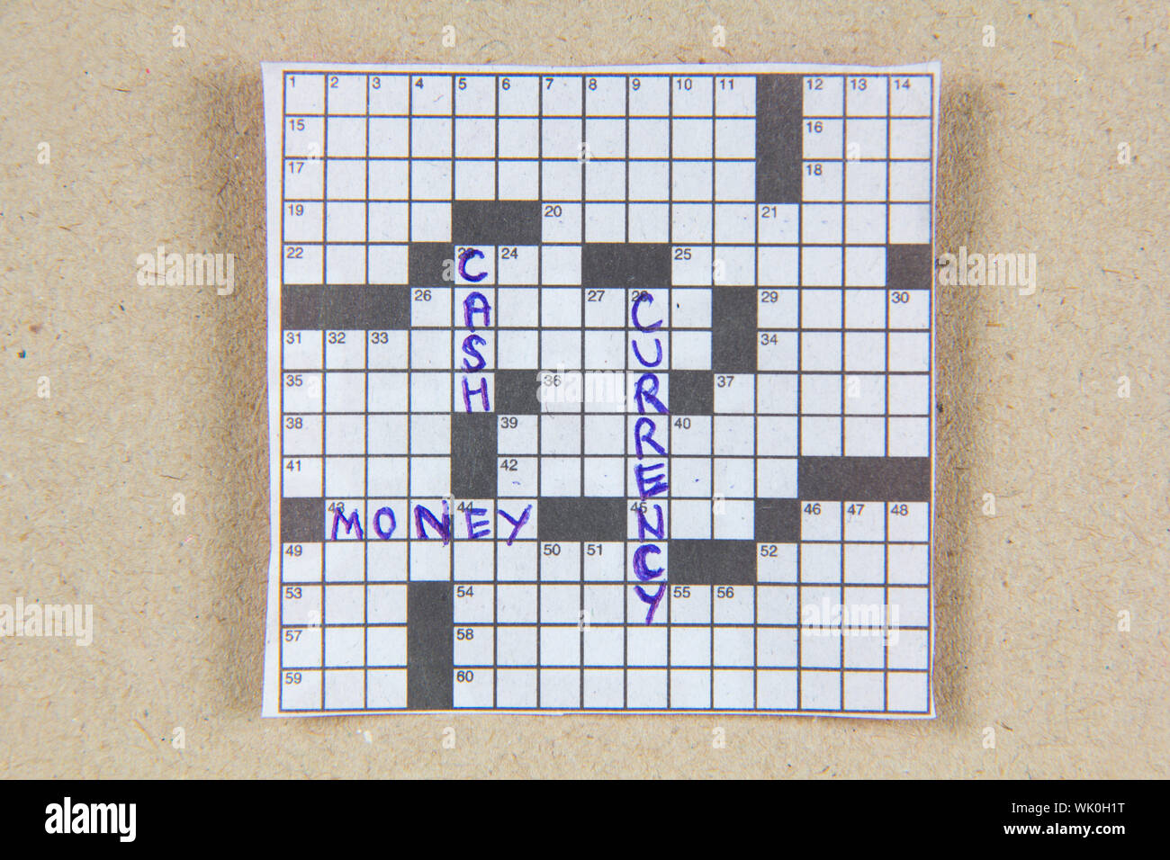 Financial word on crossword puzzle in blue ink Stock Photo Alamy