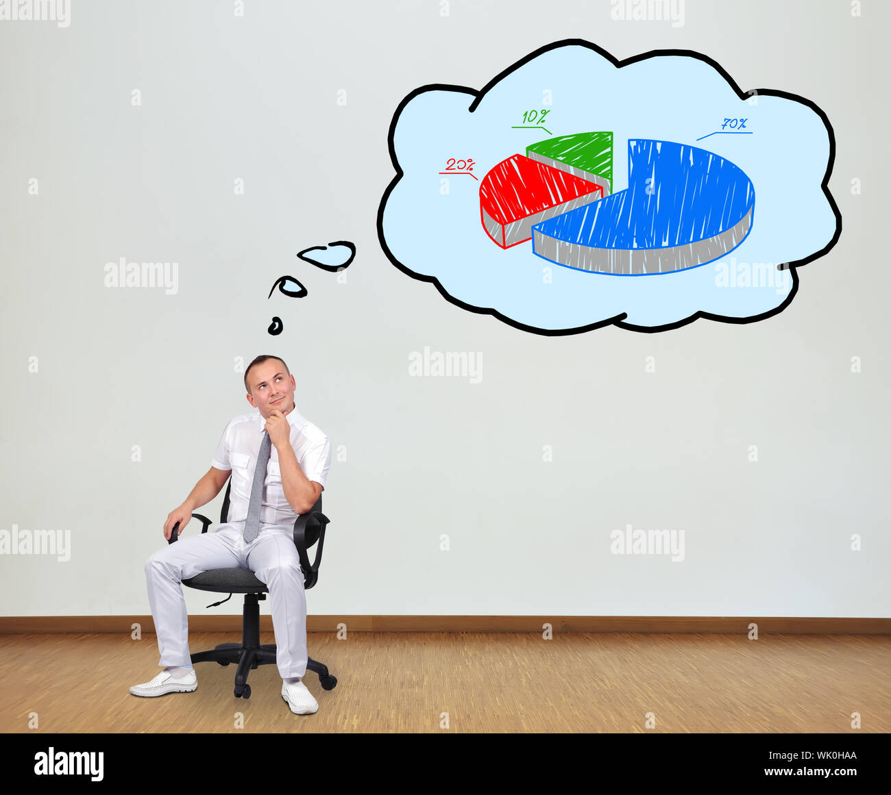 man sitting on chair and thinking about pie chart Stock Photo