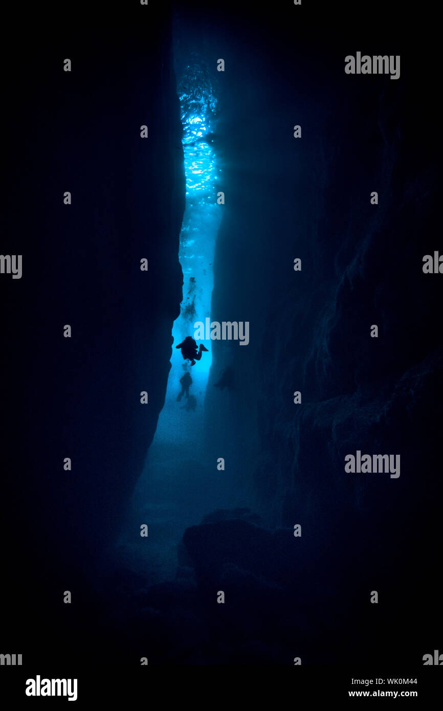 Silhouette Scuba Divers Undersea Stock Photo