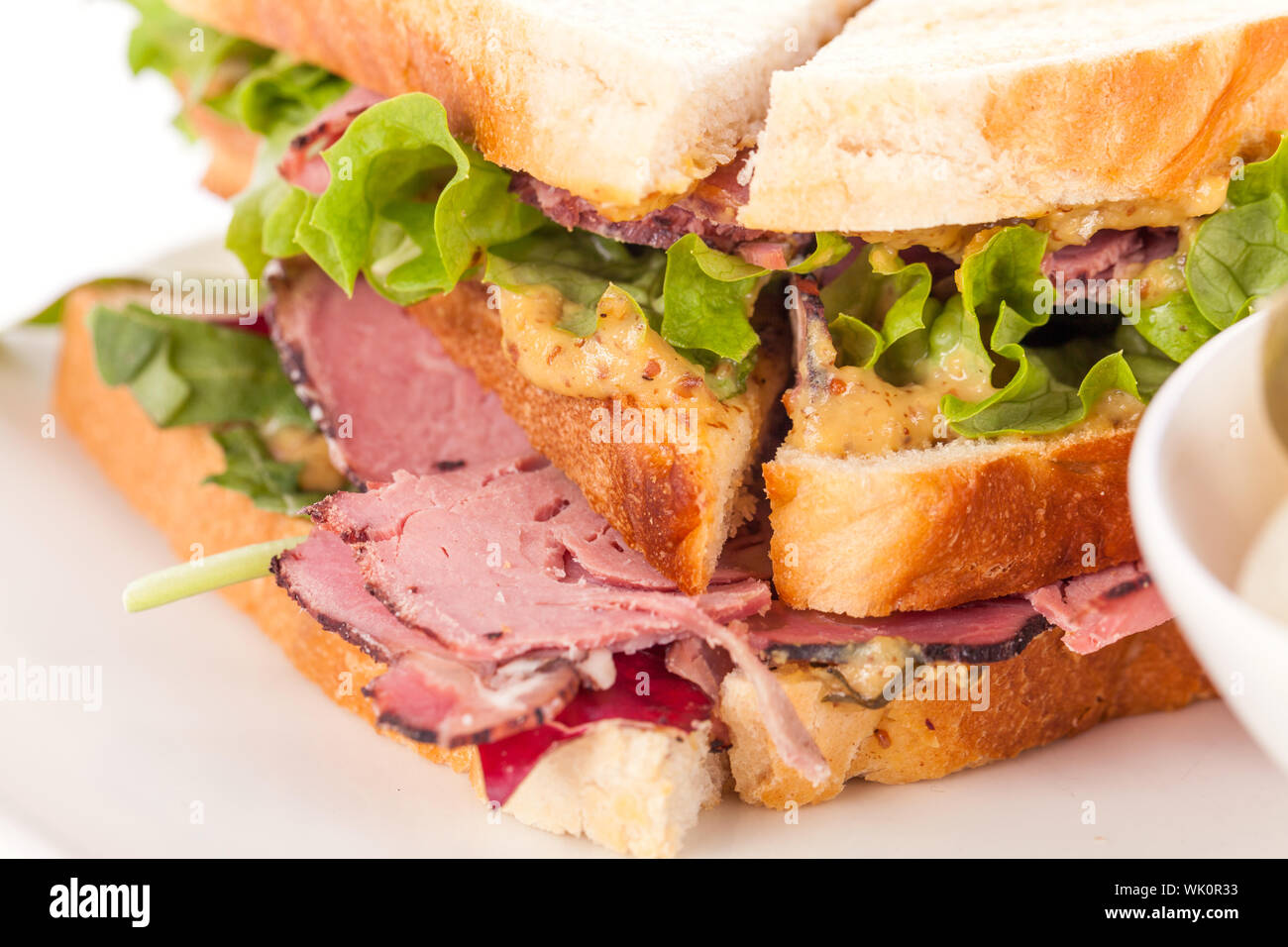 Delicious pastrami club sandwich and pickles Stock Photo Alamy