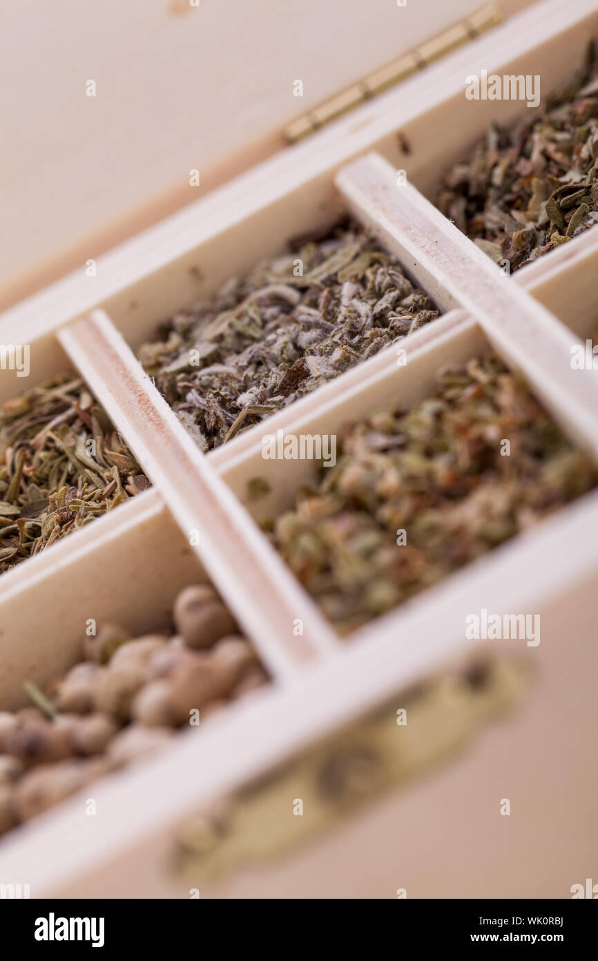 Tray with assorted dried spices and herbs Stock Photo
