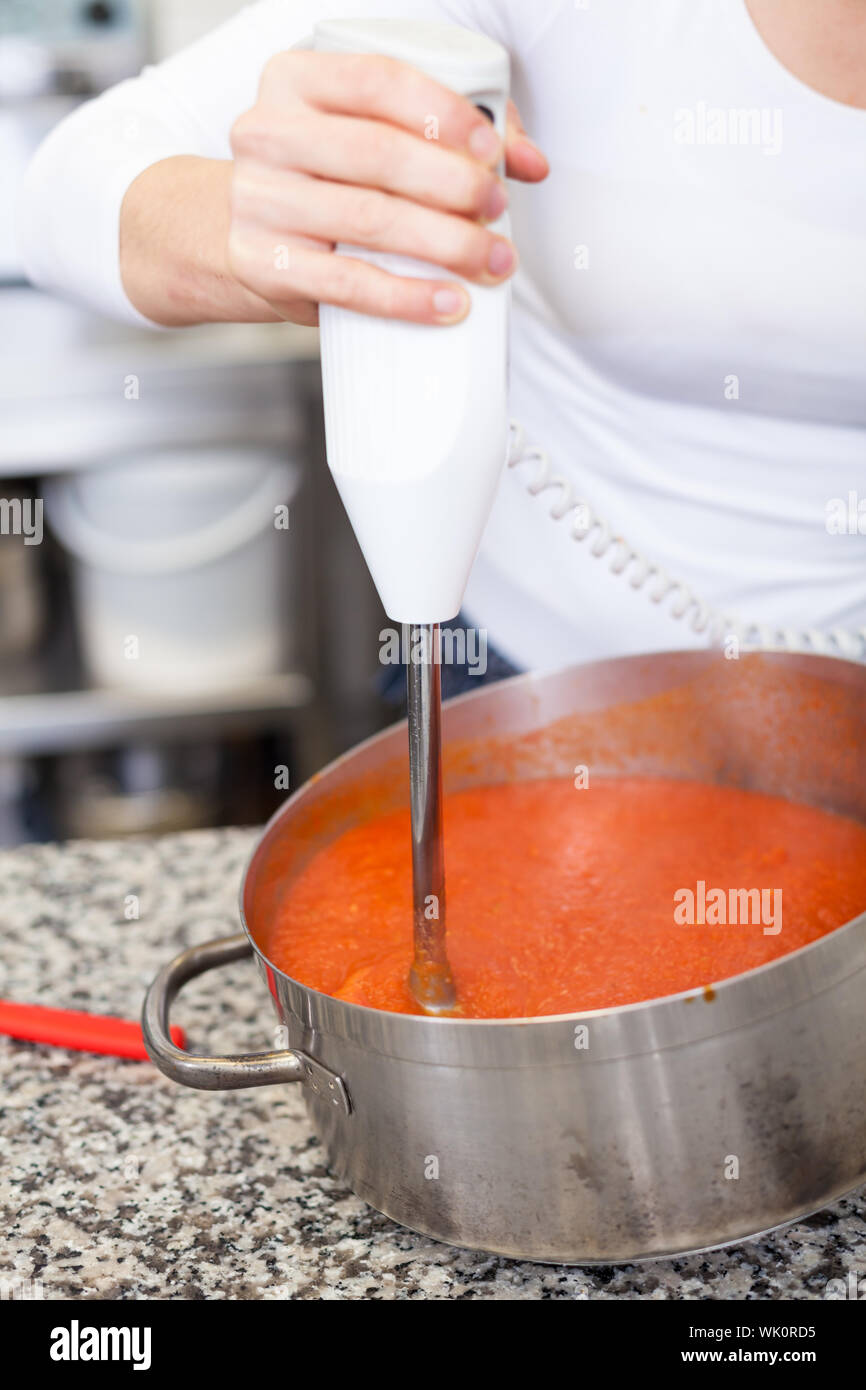 Sauce In Stainless Steel Pot High Resolution Stock Photography and
