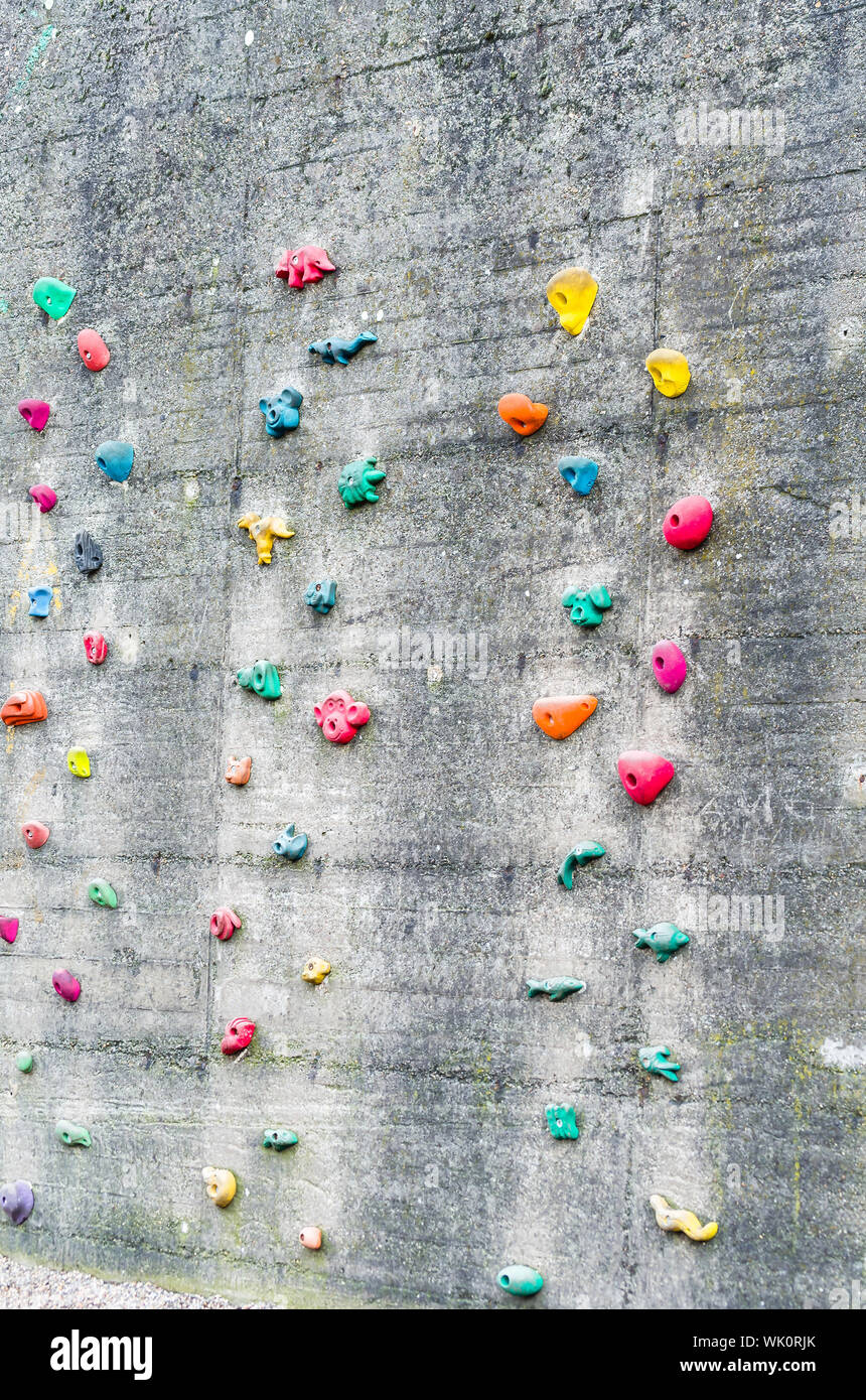 Multi Colored Handgrips On Climbing Wall Stock Photo - Alamy