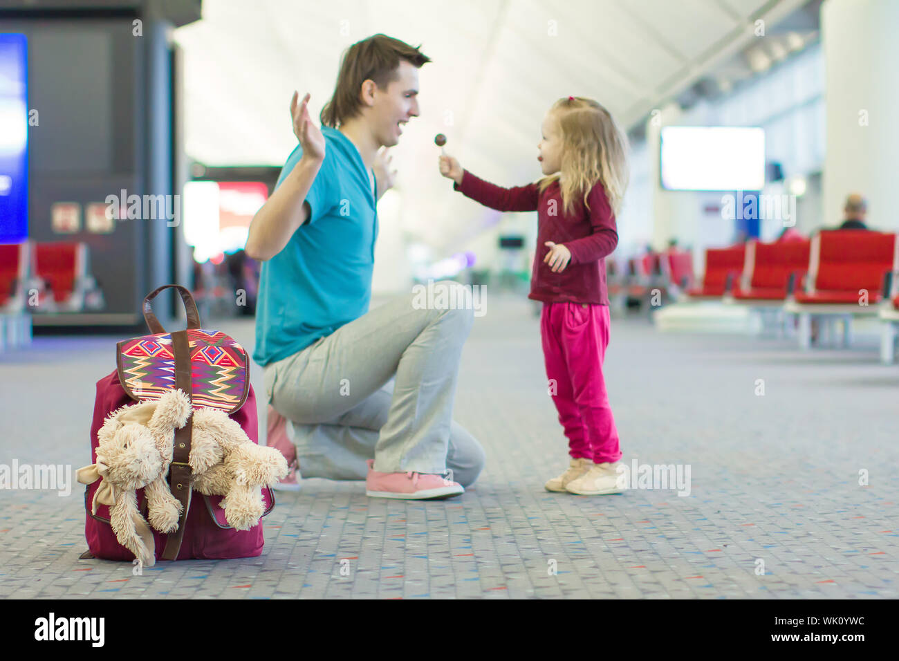 Little adorable girl and young father walking in the airport Stock ...