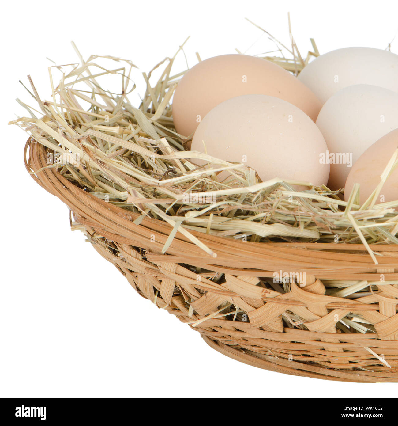 Eggs closeup on straw chicken's nest Stock Photo - Alamy