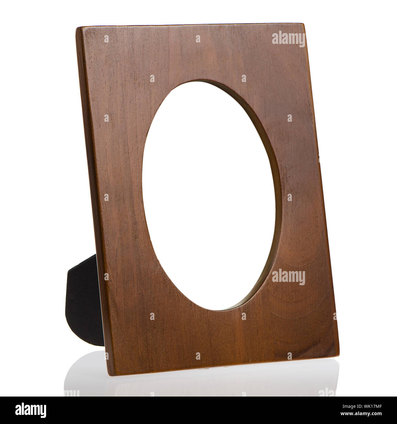 Wooden table photo frame, side view, on white reflective background