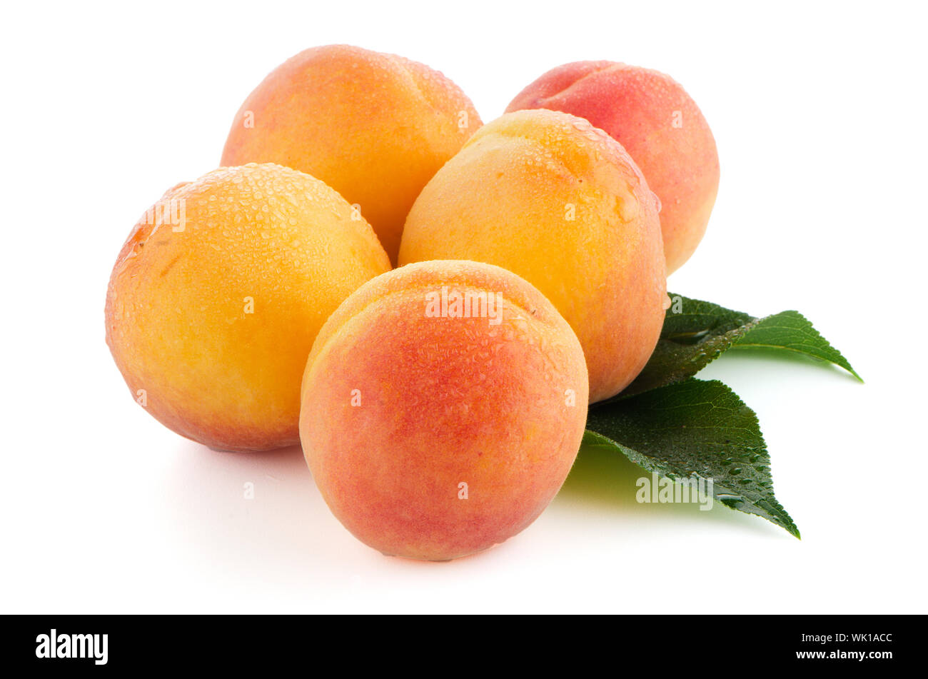 Sweet peaches with leafs on a white background Stock Photo