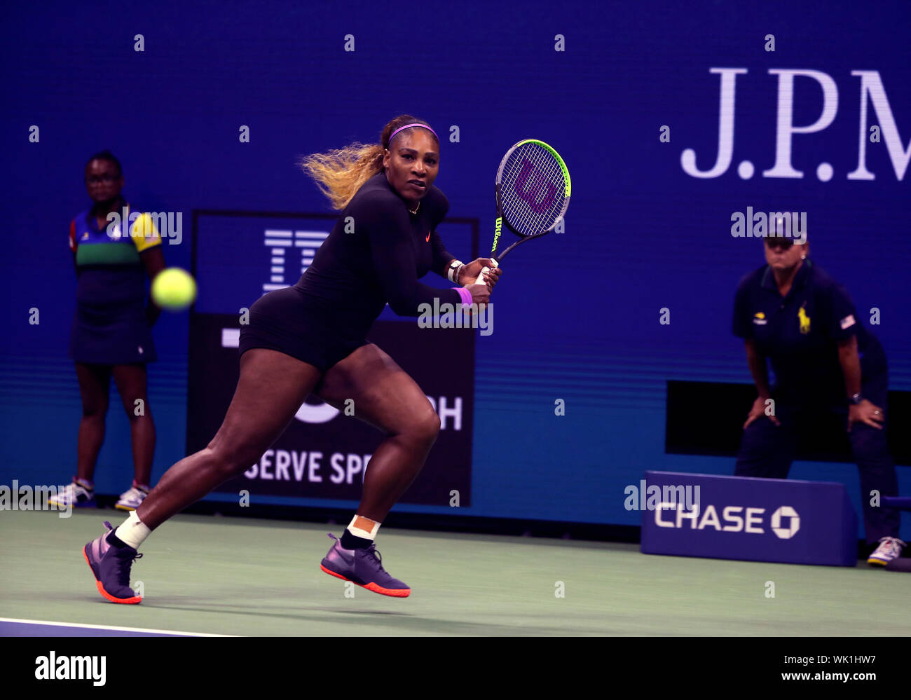 Flushing Meadows, New York, United States - 3 September 2019. Serena Williams scrambles for a backhand to Wang Qiang of China during their quarter final match at the US Open in Flushing Meadows, New York.   Williams won the match to record her 100th US Open match victory. Credit: Adam Stoltman/Alamy Live News Stock Photo