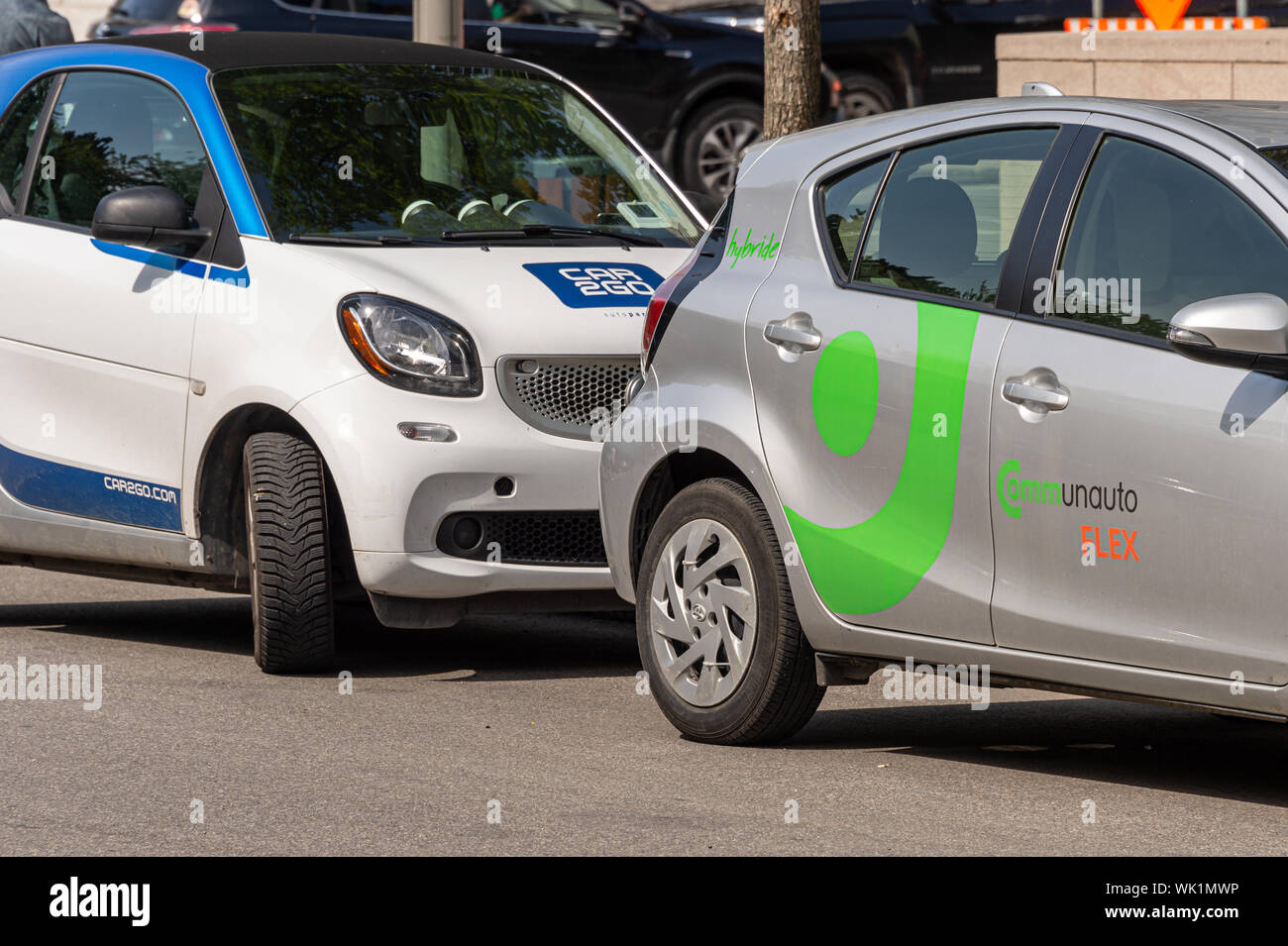 Montreal, Canada - 03 September 2019: Communauto Flex & Car2Go Cars.  Communauto & Car2Go provide carsharing services in Quebec. Stock Photo