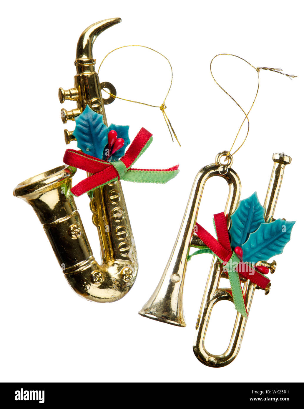 Christmas decorations, two gold plastic instruments isolated on white ...