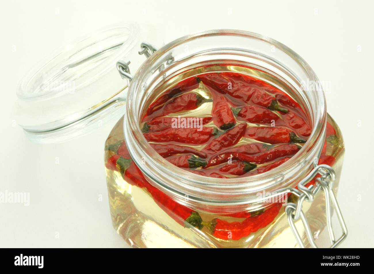 organic red chili in a jar with oil Stock Photo Alamy