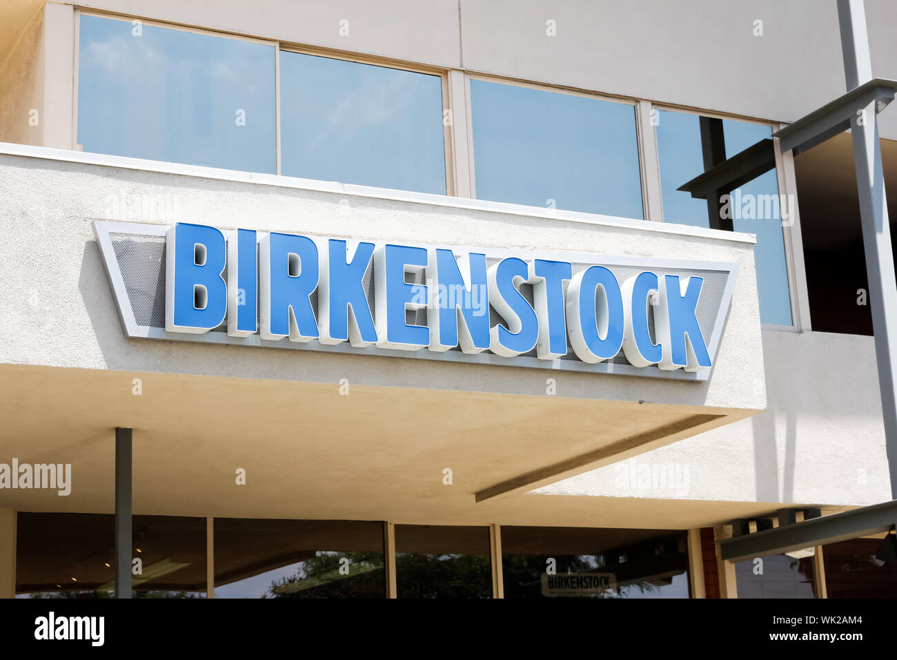 A store front sign for the shoe company known as Birkenstock Stock Photo -  Alamy