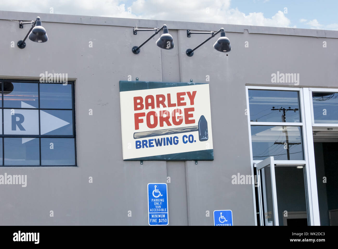 A store front sign for the restaurant and brewery known as Barley Forge Brewing Company. Stock Photo