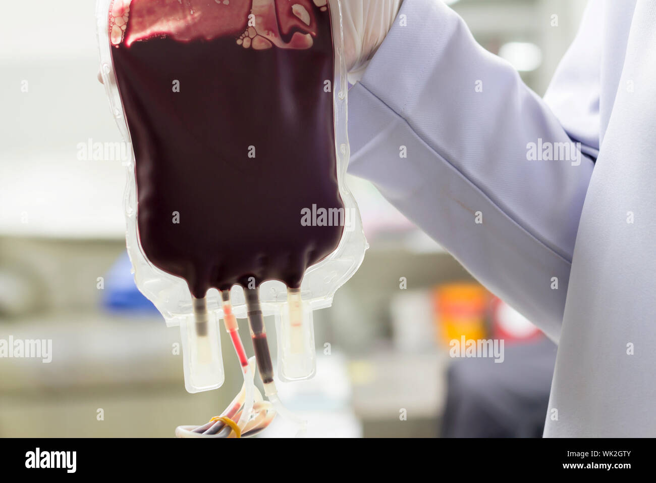 Midsection Of Doctor Blood Bag During A Blood Transfusion Stock Photo