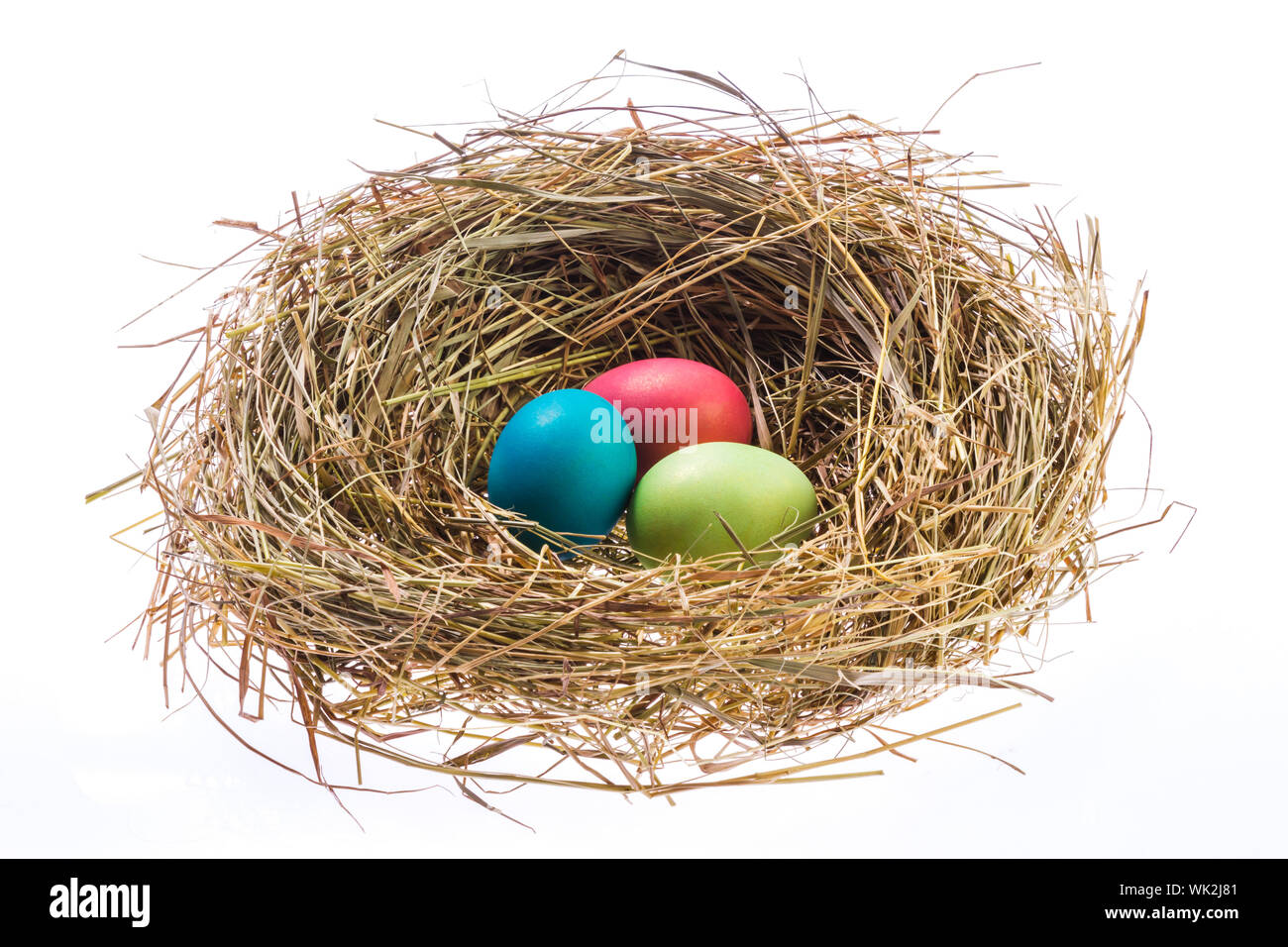 Nest with Easter eggs isolated on white background Stock Photo - Alamy