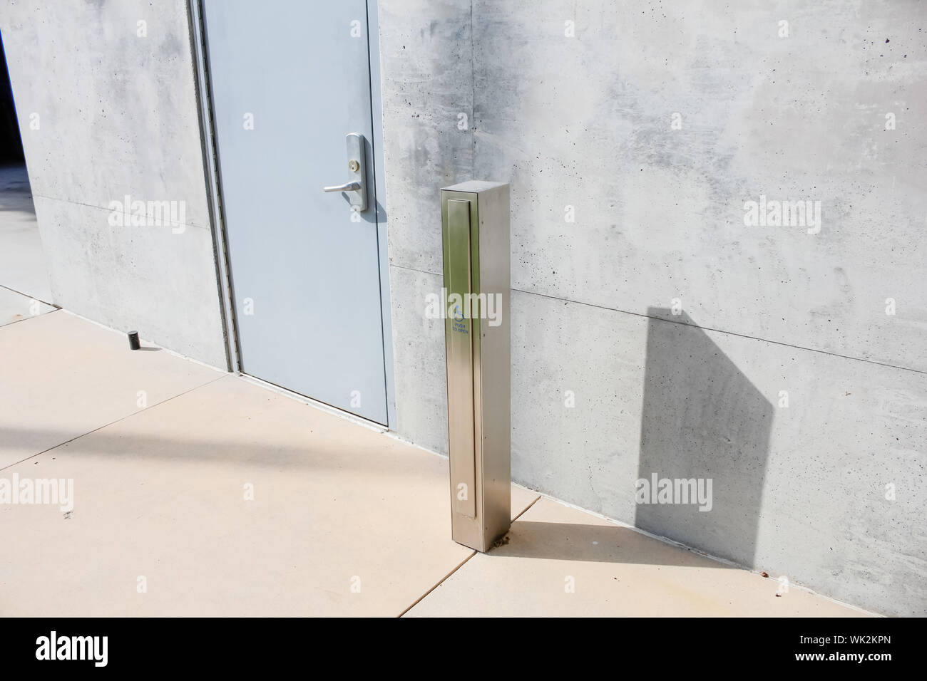 A Convenient Handicap Access Door Button Panel Post For A Building