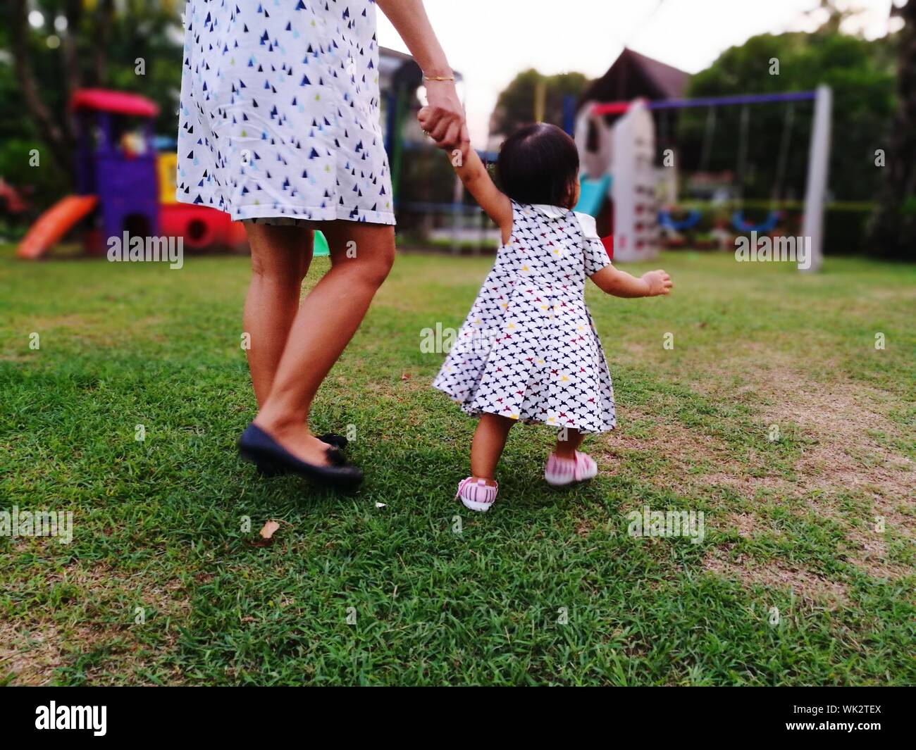 Mother Holding Toddler's Hand Stock Photo