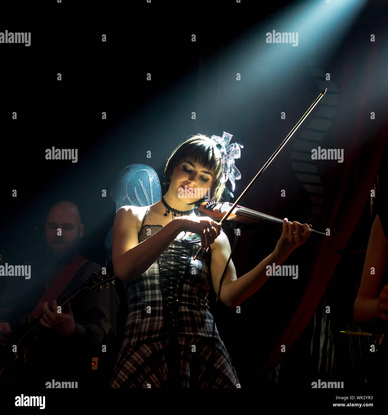Female Violinist Playing Violin In Nightclub Stock Photo
