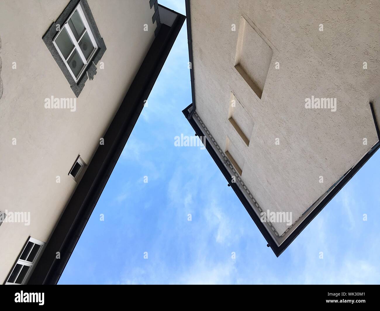 Directly Below View Of Houses At Bad Tolz Against Blue Sky Stock Photo