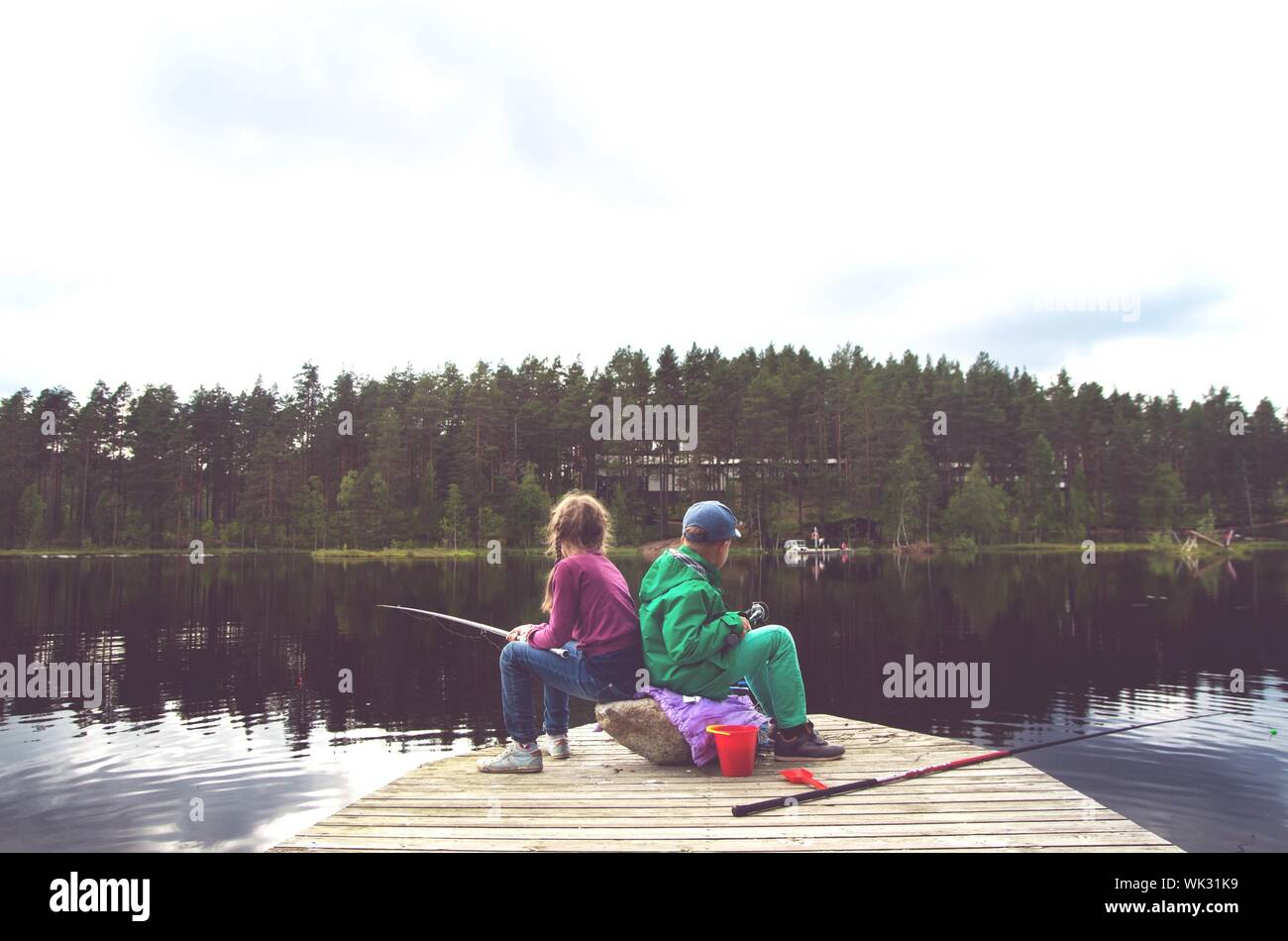 Two boys sitting fishing hi-res stock photography and images - Alamy