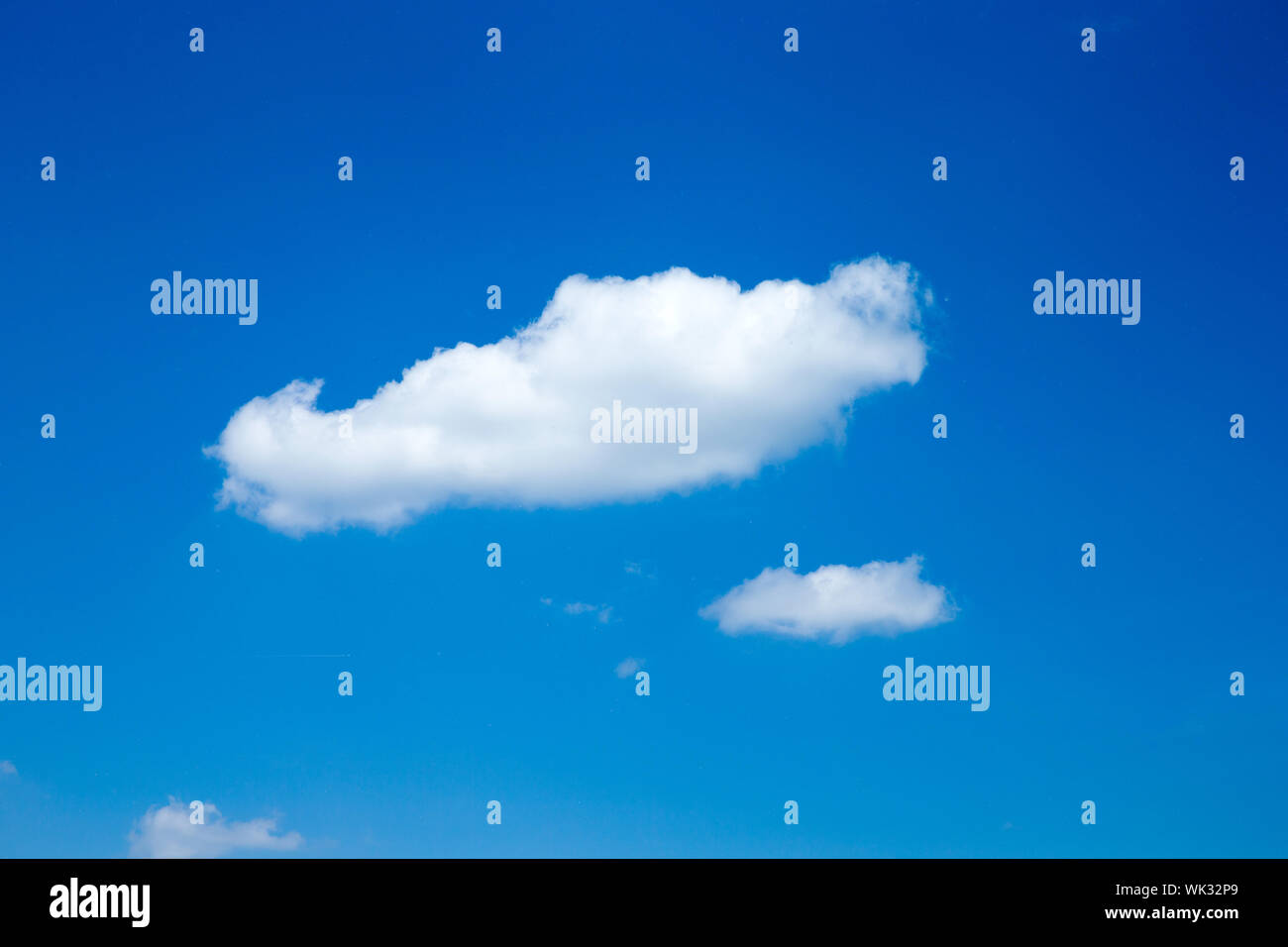 Blue sky background with a tiny clouds Stock Photo - Alamy