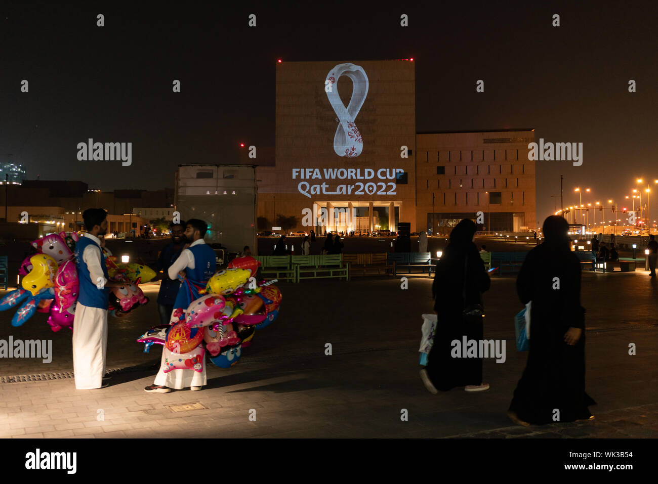 The official emblem for the Qatar 2022 FIFA World Cup has been unveiled in a synchronized projection of the logo onto some of the Qatar's most iconic buildings and in 24 other major cities across the world. The swooping curves of the emblem represent the undulations of desert dunes and the unbroken loop depicts both the number eight - highlighting the eight stadiums that will host the World Cup matches - and the infinity symbol, which reflects the interconnected nature of the event, according to tournament organizers. Stock Photo